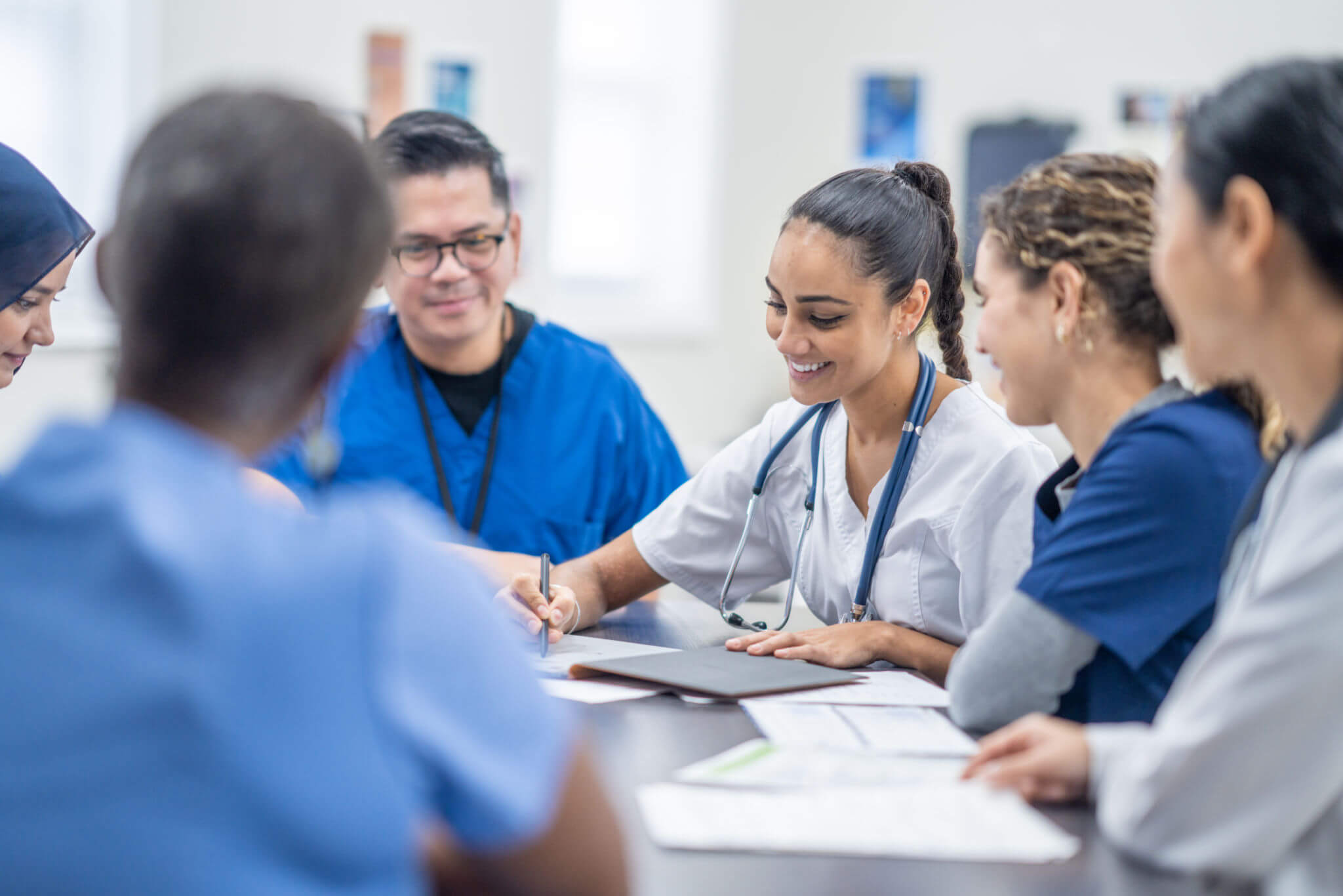 Nurses and doctors collaborating in hospital setting